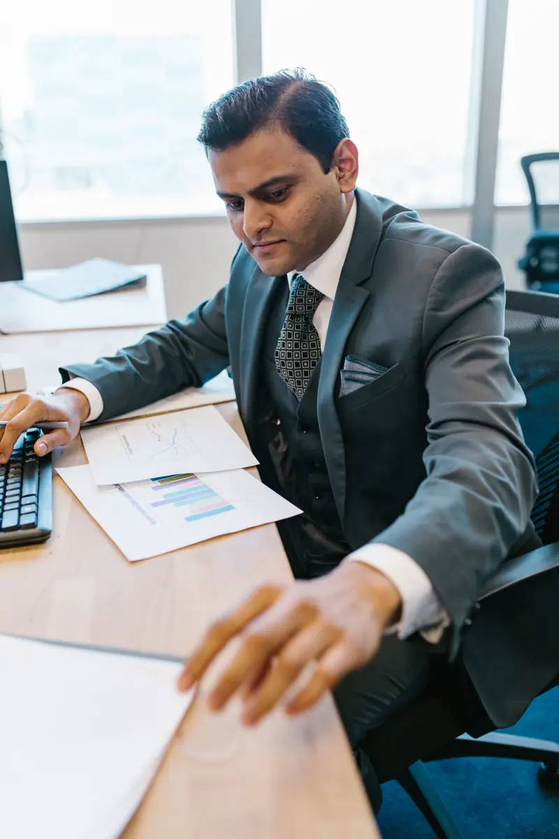 Finance professional working at his desk
