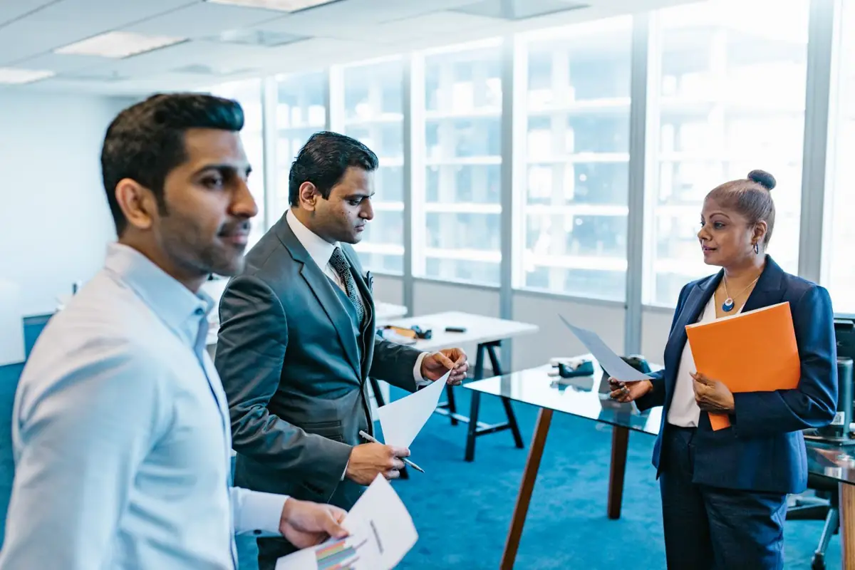 Consultants advising business leaders in an office