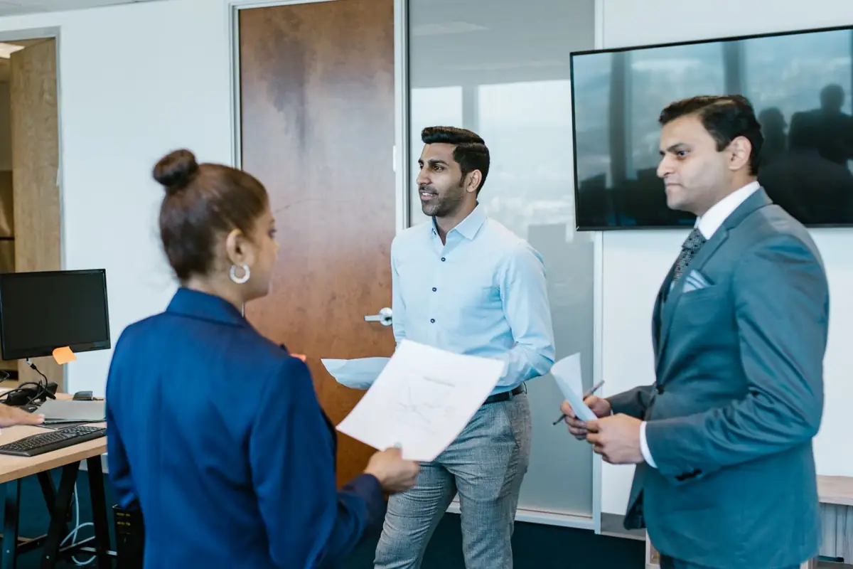 Chartered accountants reviewing documents with a client